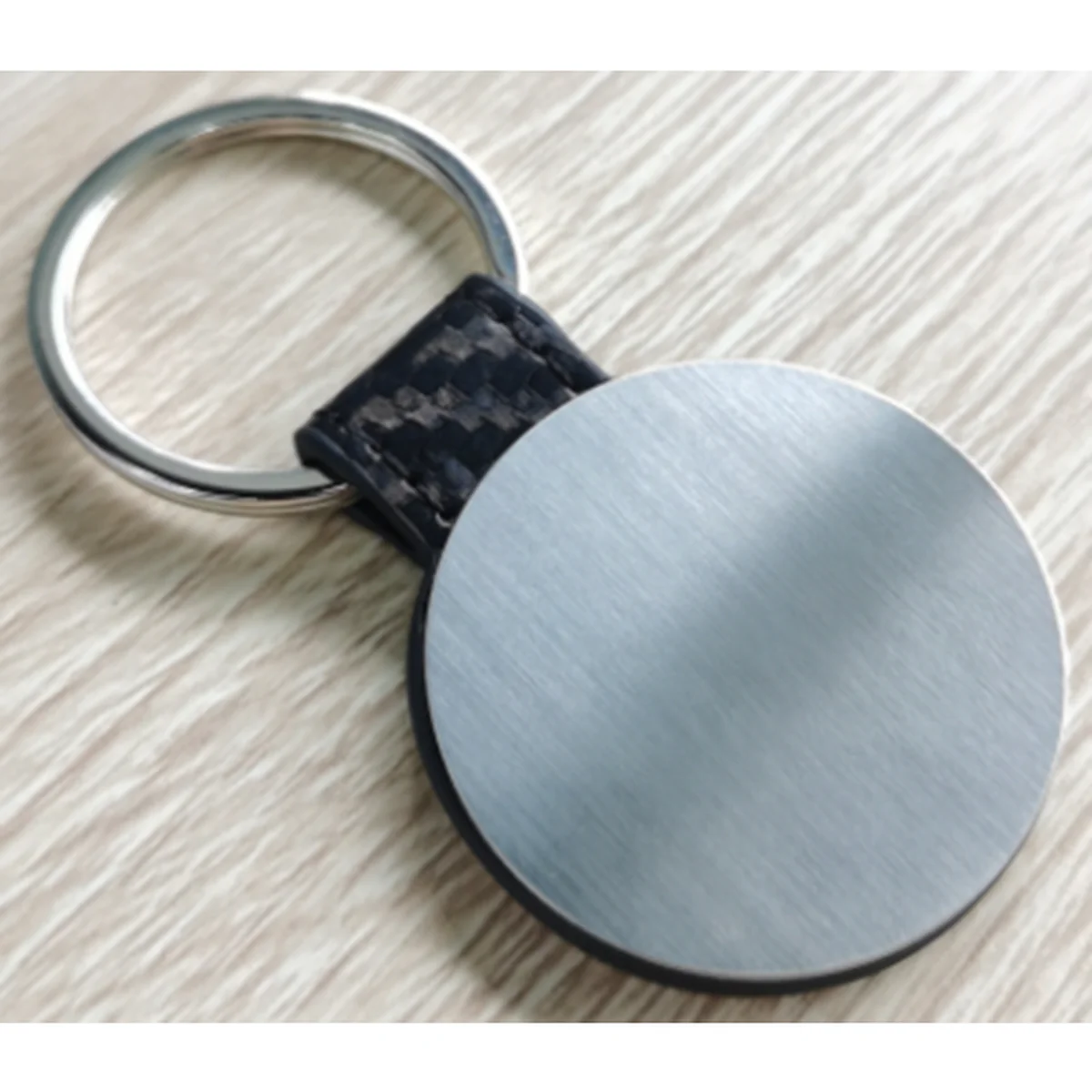 Porte clé rond metalique avec ance simili tressé
